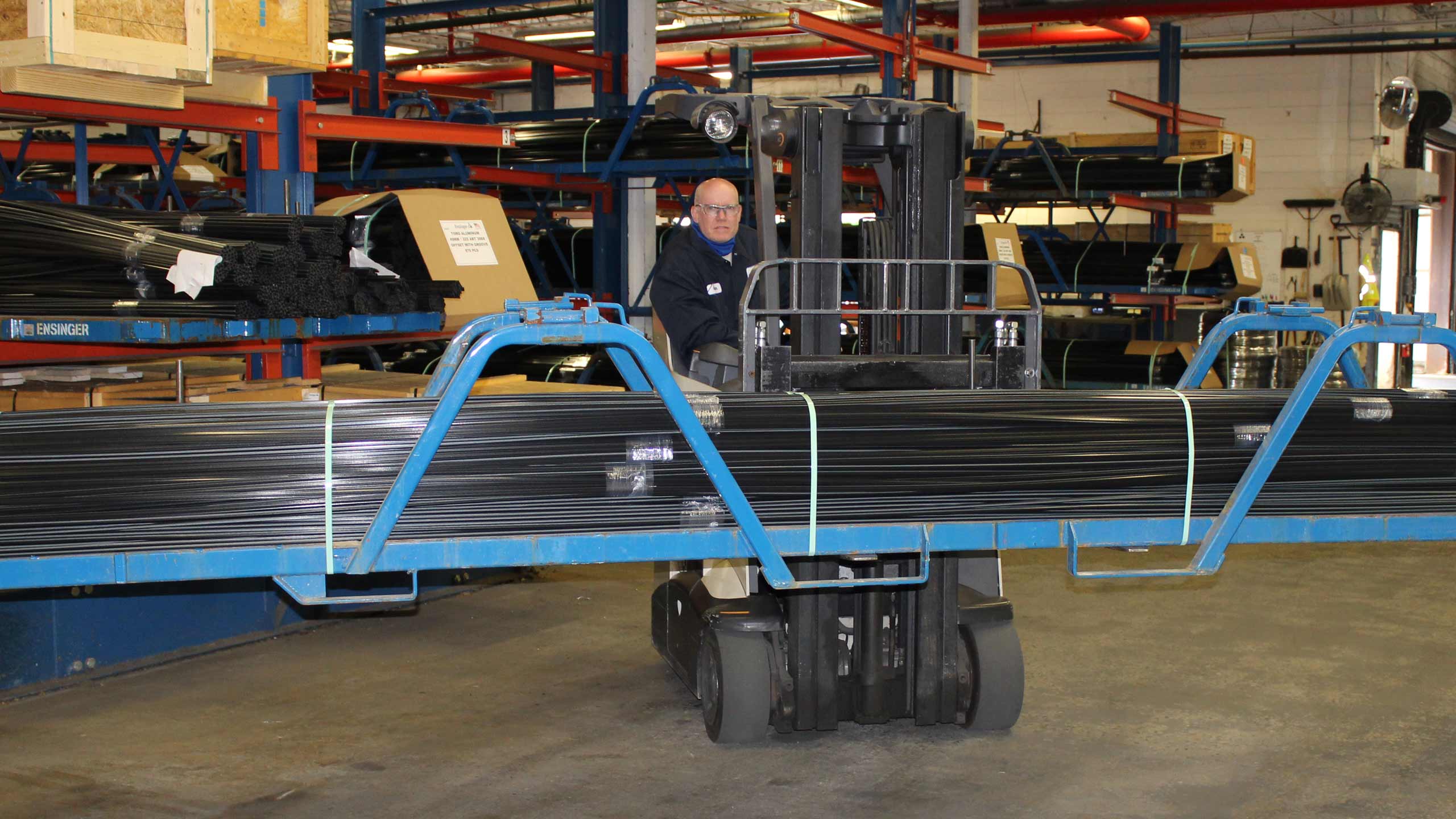 Warehouse worker transports insulbar insulating bars